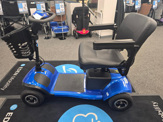 Fully refurbished blue King Cobra mobility scooter with comfortable seat and storage basket on display indoors.