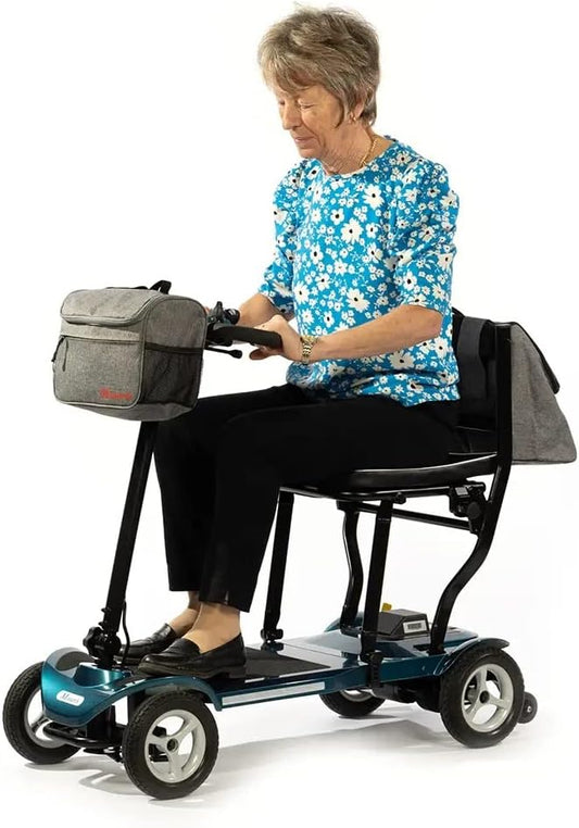 Elderly woman sitting on ultra-light Eden Air Mobility Scooter with four wheels and front storage bag