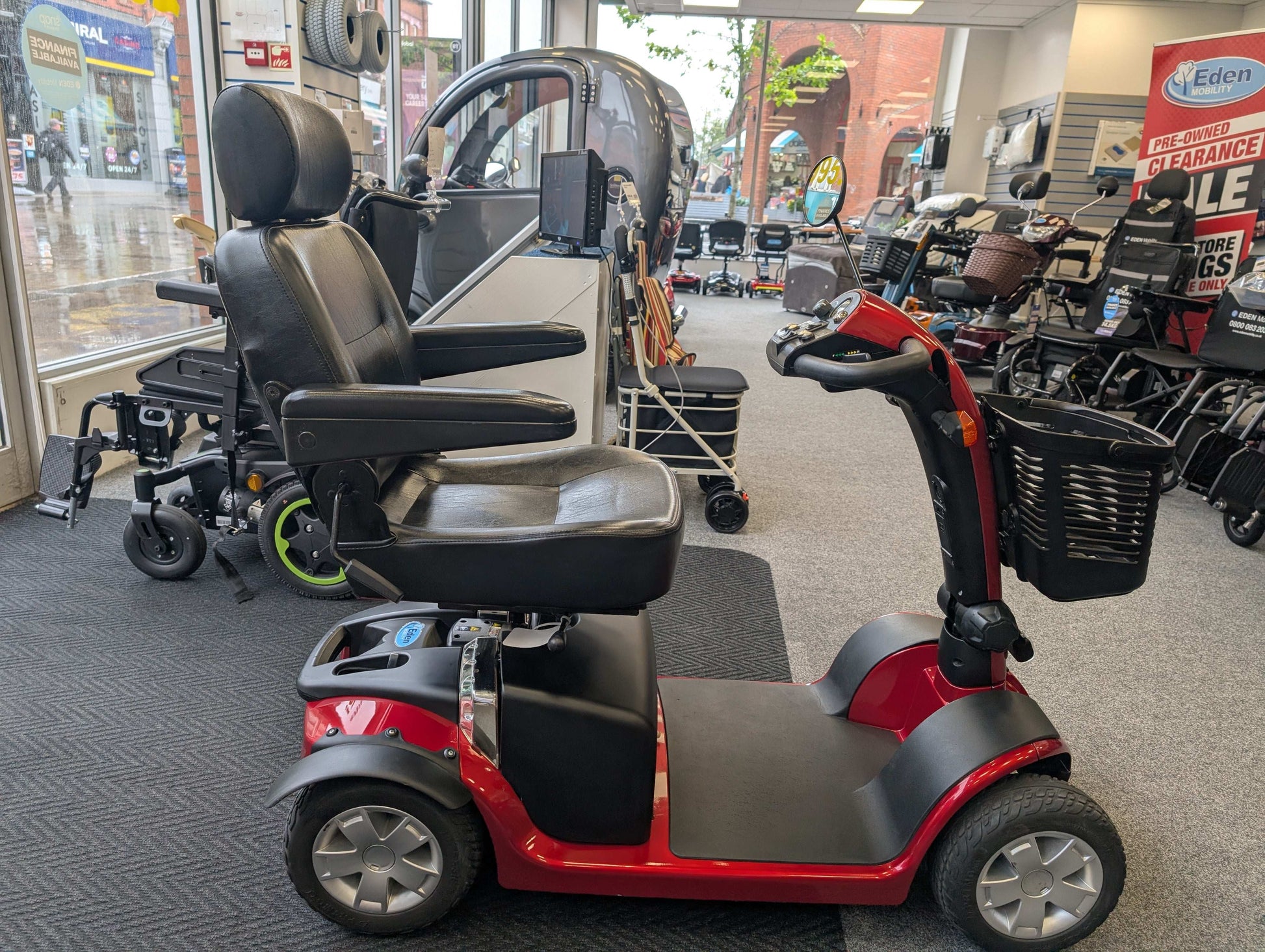 Red Pride Colt Mobility Scooter in showroom
