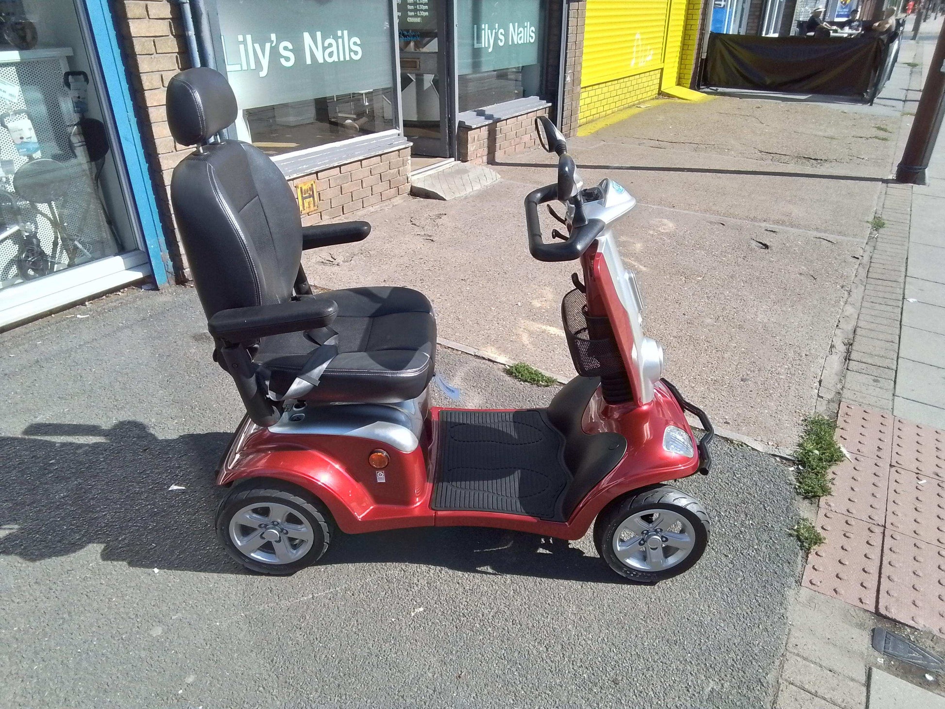 Side View Of Kymco Maxi XLS Red Mobility Scooter