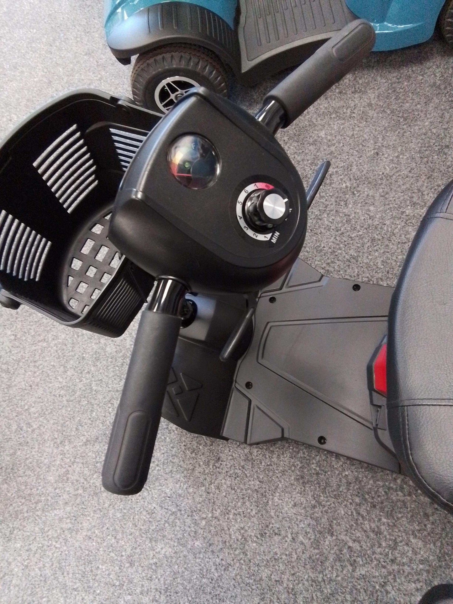 Close up of basket on Drive Compact Lite Mobility Scooter In Red