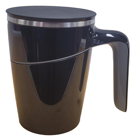 Black mug with a handle on a wooden surface