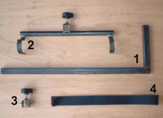 Set of metal brackets for a mobility scooter walker holder and components on a wooden surface