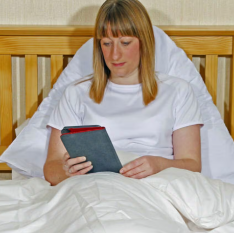 Woman on phone in bed