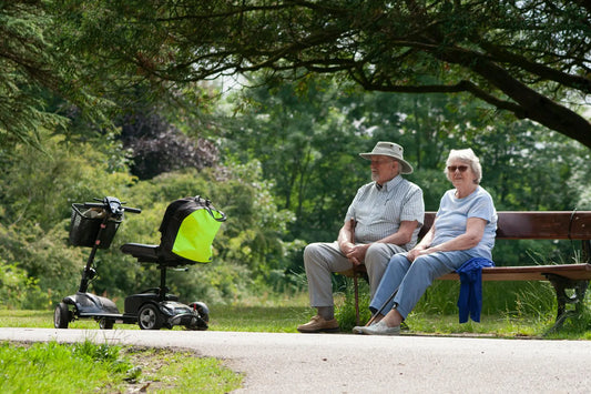 elderly couple with mobility scooter