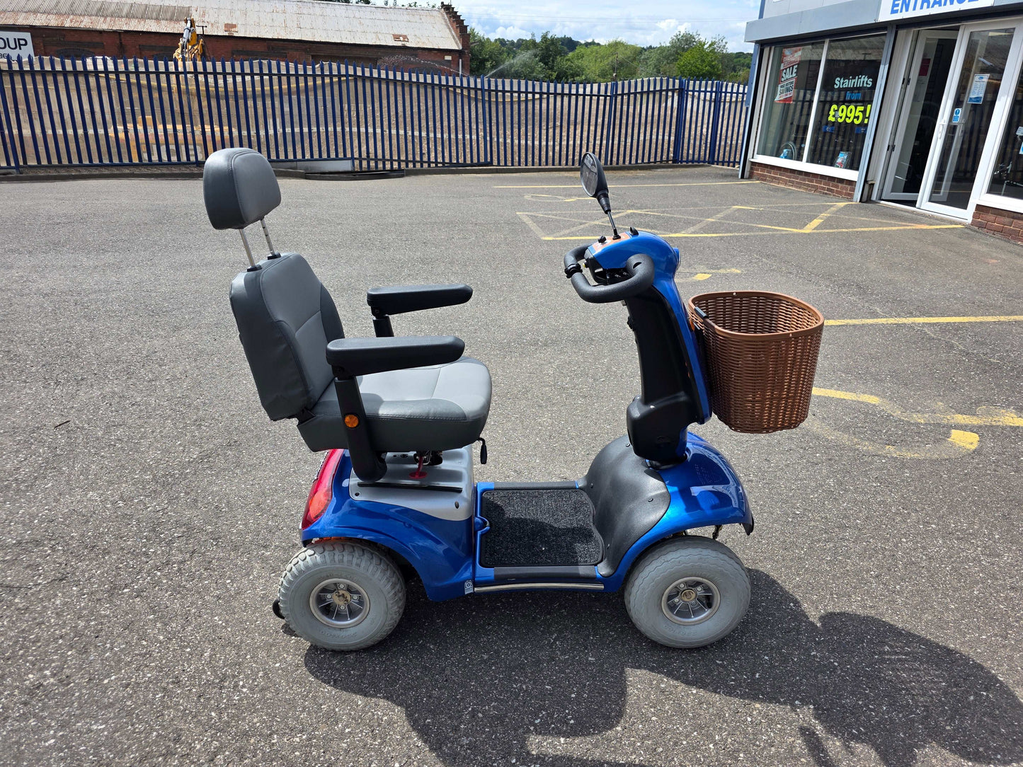 Blue Roma Shoprider Mobility Scooter outside Eden Mobility shop