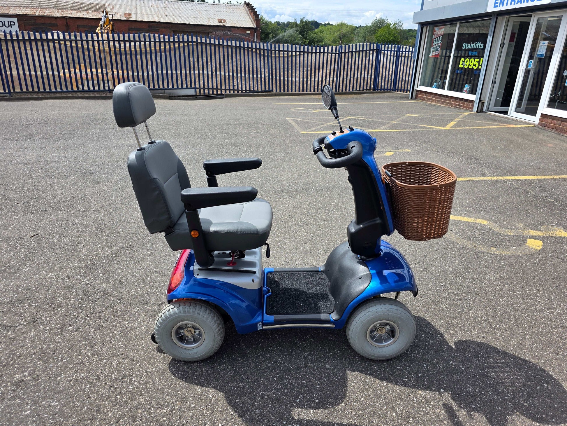 Blue Roma Shoprider Mobility Scooter outside Eden Mobility shop
