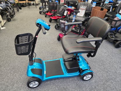Blue Li-tech Air mobility scooter with black seat and armrests displayed indoors on gray carpet flooring