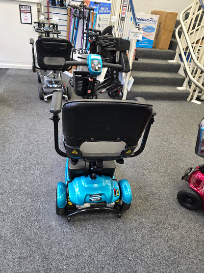 Refurbished blue Li-tech Air mobility scooter with black seat and armrests displayed indoors on grey carpet floor