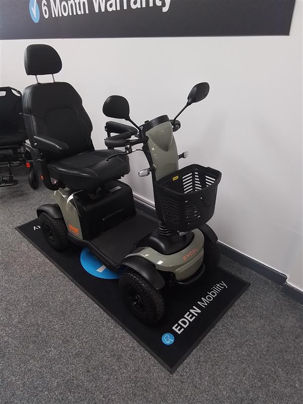 Refurbished Excel Evo green mobility scooter with comfortable seat, basket, and mirrors on display at Eden Mobility Doncaster showroom