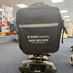 Black mobility scooter with Eden Mobility scooter bag branding in a showroom setting