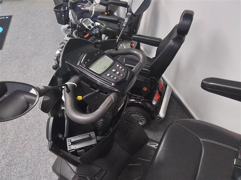 Close-up view of the fully refurbished grey Drive King Cobra scooter with control panel and comfortable seat.