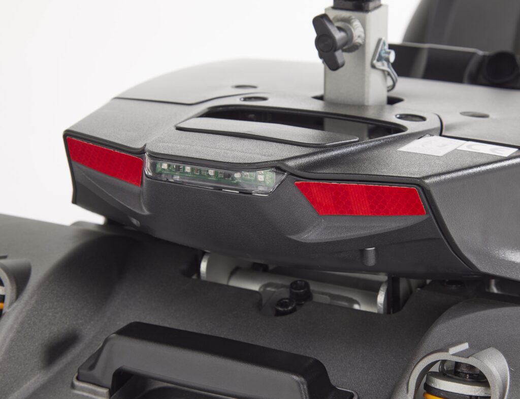 Rear view of Eden Essential Aura 4mph Boot Mobility Scooter showing red reflectors and tail light assembly
