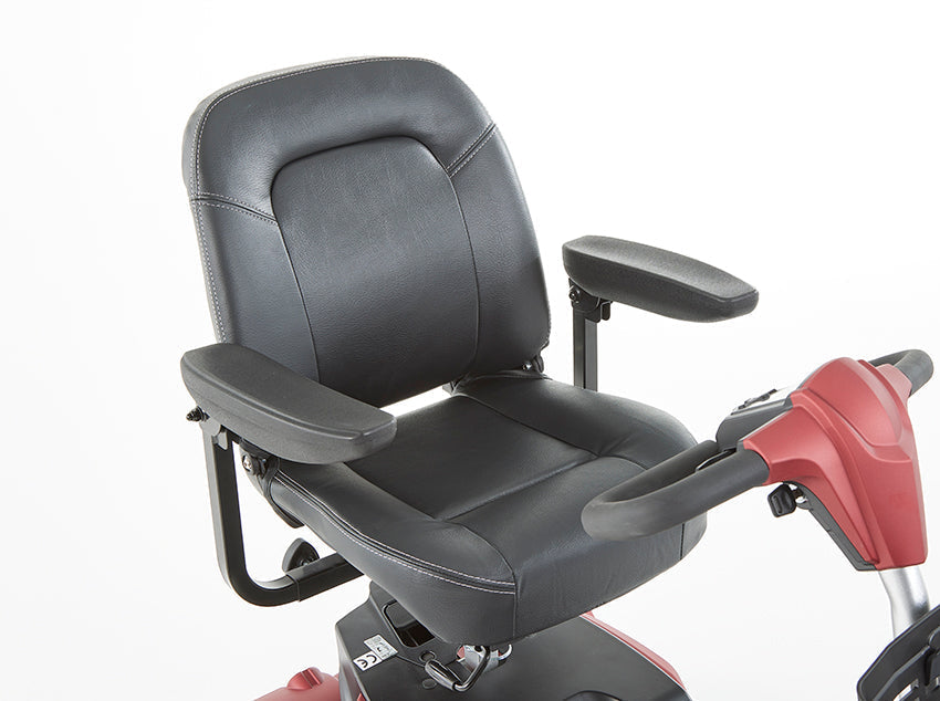 Close-up of black leather seat and armrests on The Eden Essential Aura 4mph boot mobility scooter with red handles
