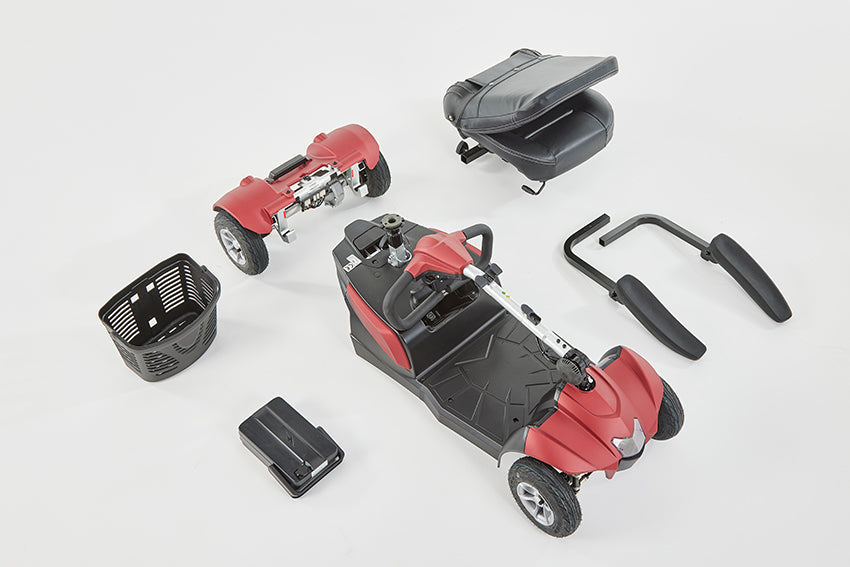 Disassembled red Eden Essential Aura mobility scooter components including base, seat, basket, and handles for easy transport.