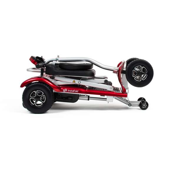 Drive InstaFold automatic folding mobility scooter in compact folded position with red and silver frame design
