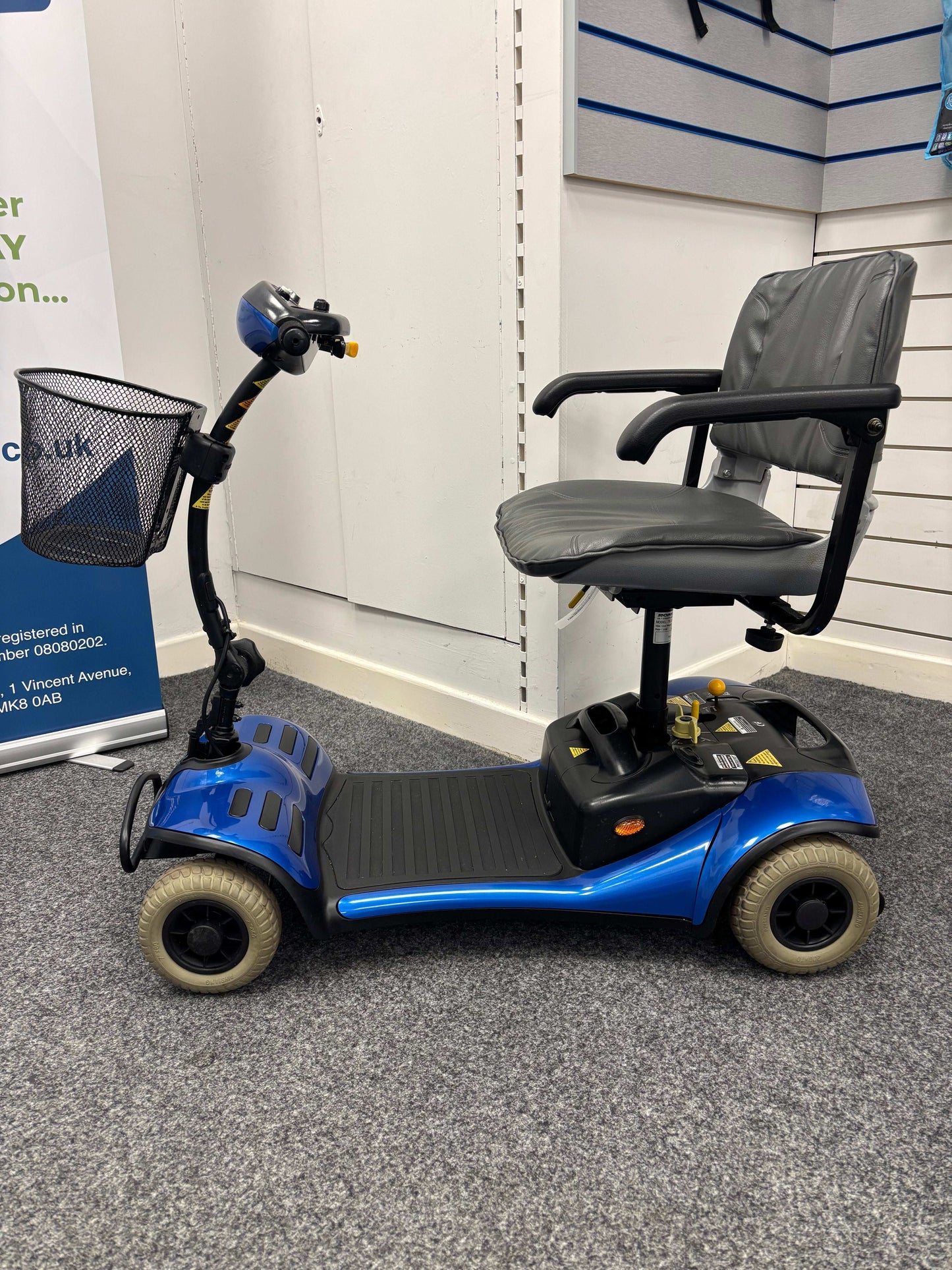Side of Roma Cameo - Blue mobility scooter in shop