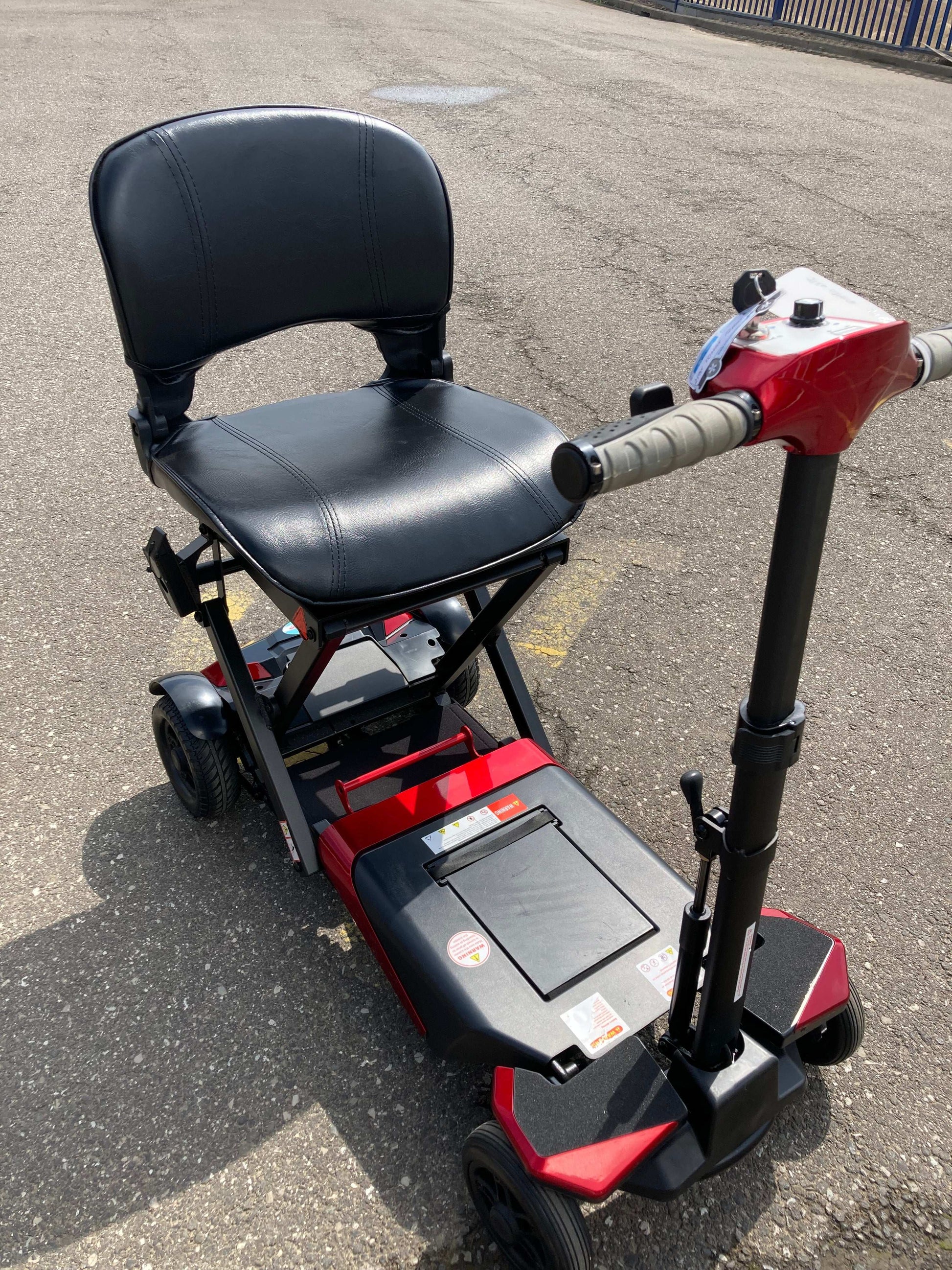 Solax mobility scooter in red outside