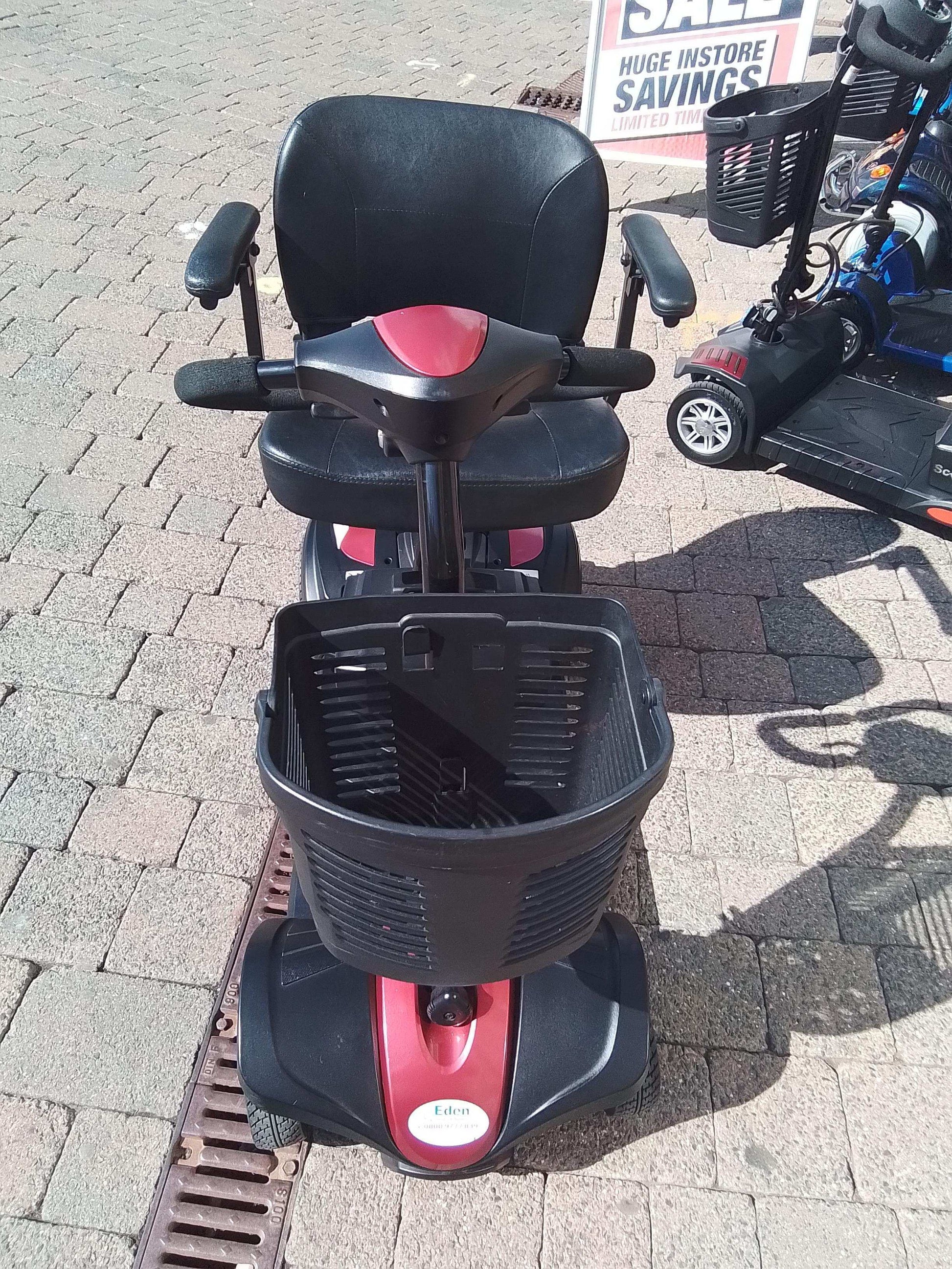 Red and black mobility scooter