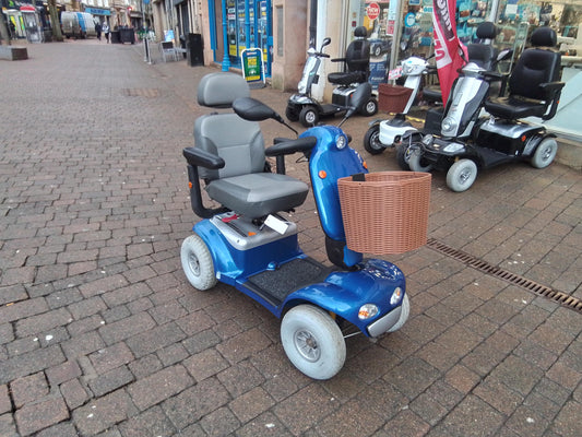 image of a second hand mobility scooter outside an Eden Mobility store