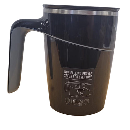 Black mug with a handle and safety label on a white background