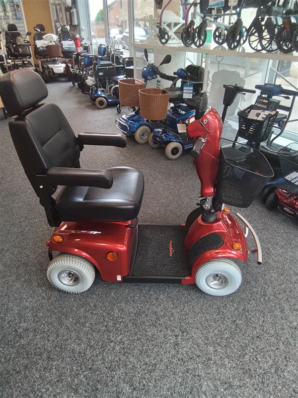 Red mobility scooter in showroom