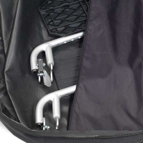 Foldable wheelchair inside a black travel bag