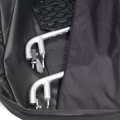 Foldable wheelchair inside a black travel bag