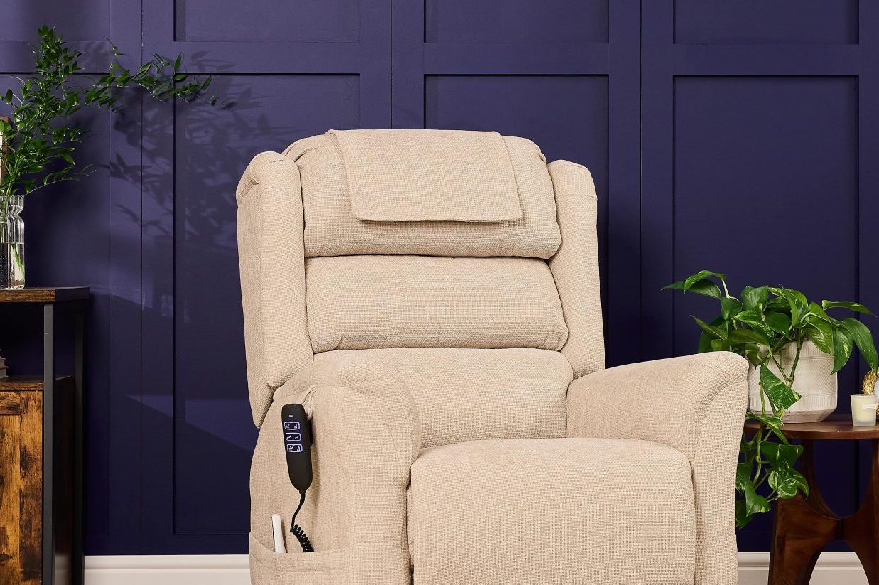 Cream Sanford Rise and Recliner chair with dual motor control, heat, and massage features in a modern living room setting