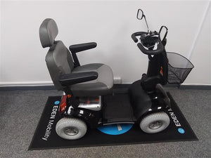 Refurbished Roma Shoprider Cadiz black mobility scooter with padded seat and armrests on showroom floor mat