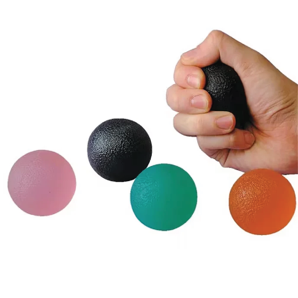 Hand squeezing black gel ball with three additional colored gel balls for hand and forearm exercise on white background