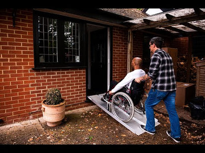 Man Using Folding Aluminium Wheelchair Ramp