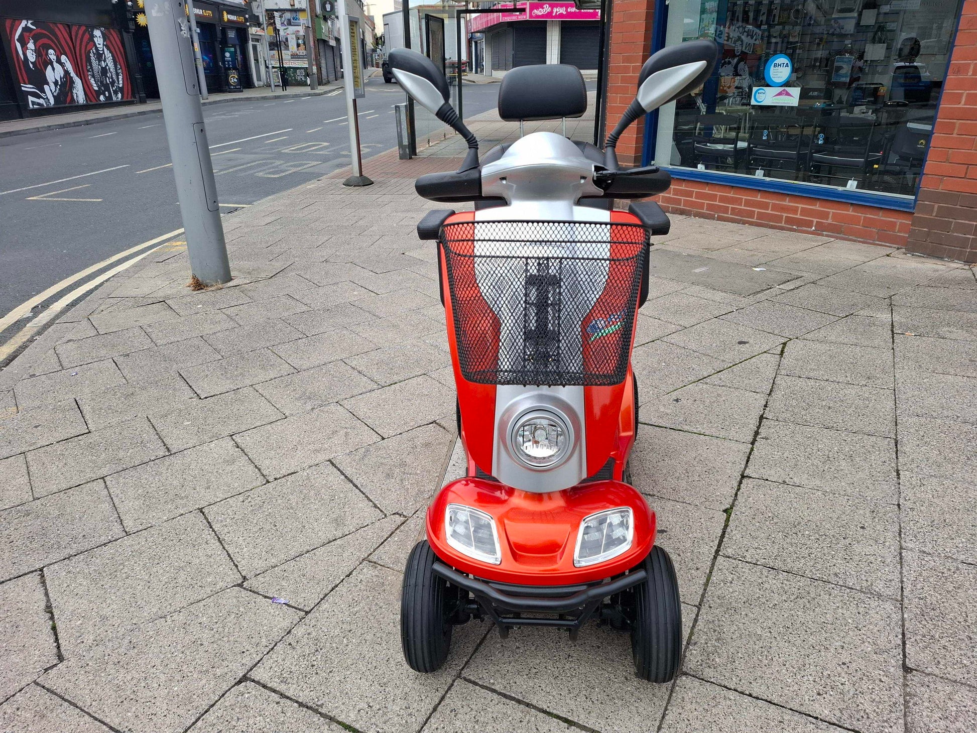 Kymco Midi Orange Scooter on street