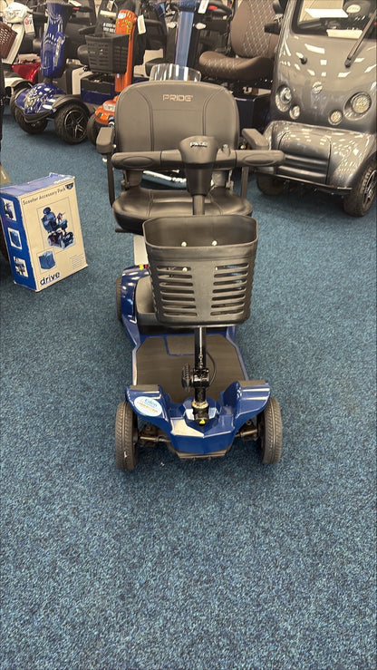 Refurbished Pride Apex Lite Blue mobility scooter with front basket, black seat, and control panel on indoor showroom floor