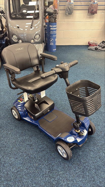Refurbished Pride Apex Lite mobility scooter in blue with black seat and front storage basket on showroom floor