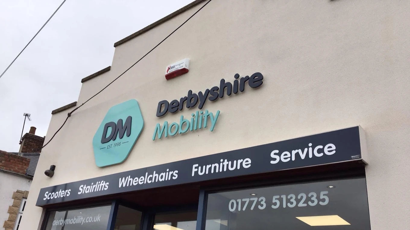 Exterior view of Derbyshire Mobility storefront with signage displaying services like scooters and wheelchairs